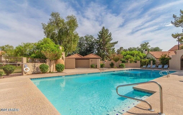 view of pool featuring a patio