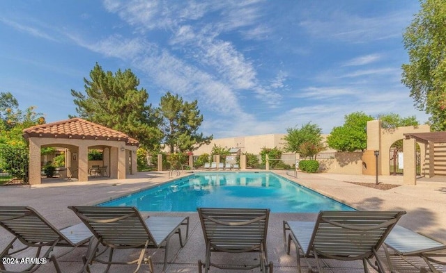 view of swimming pool featuring a gazebo and a patio