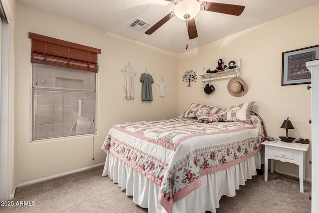 bedroom featuring carpet flooring, a ceiling fan, and visible vents