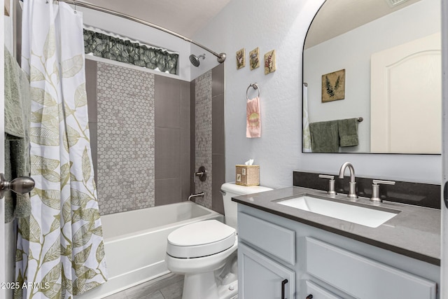 bathroom featuring wood finished floors, toilet, vanity, and shower / bath combo with shower curtain