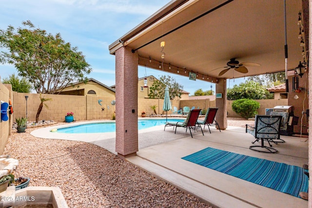 view of pool featuring a patio, a fenced backyard, a fenced in pool, a ceiling fan, and area for grilling