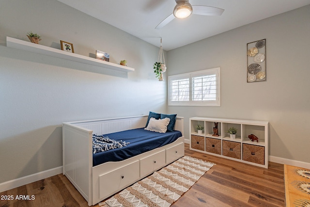 1702 W Wildwood Dr, Phoenix, AZ 85045 - bedroom featuring baseboards, ceiling fan, and wood finished floors
