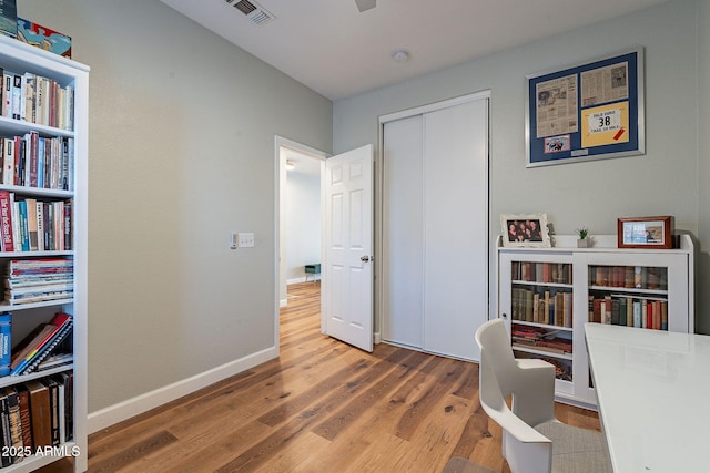 1702 W Wildwood Dr, Phoenix, AZ 85045 - office with wood finished floors, baseboards, and visible vents