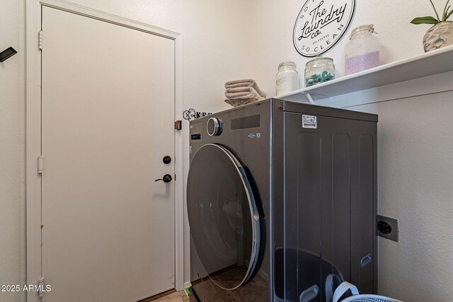 1702 W Wildwood Dr, Phoenix, AZ 85045 - laundry room with laundry area, a textured wall, and washer / dryer