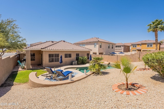 1702 W Wildwood Dr, Phoenix, AZ 85045 - back of house with a patio area, a fenced backyard, a tiled roof, and stucco siding
