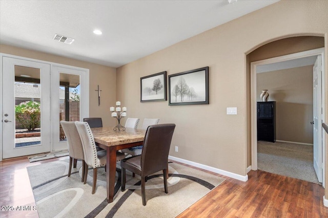 11025 E Nichols Ave, Mesa, AZ 85209 - dining room with baseboards, wood finished floors, recessed lighting, and arched walkways