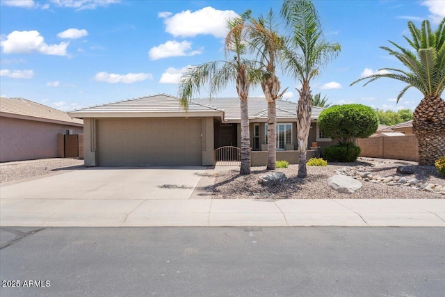 11025 E Nichols Ave, Mesa, AZ 85209 - view of front of house with a garage, stucco siding, driveway, and a tiled roof