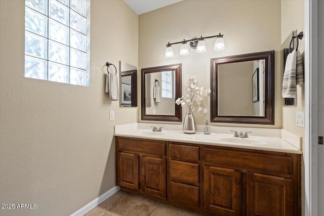11025 E Nichols Ave, Mesa, AZ 85209 - full bath featuring double vanity, tile patterned floors, and baseboards
