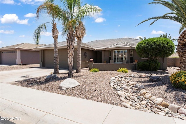 11025 E Nichols Ave, Mesa, AZ 85209 - ranch-style home featuring an attached garage, driveway, and stucco siding