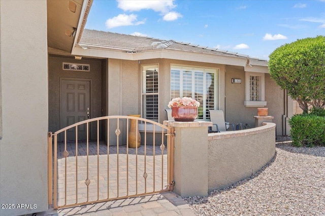 11025 E Nichols Ave, Mesa, AZ 85209 - entrance to property featuring stucco siding, a gate, and a tiled roof