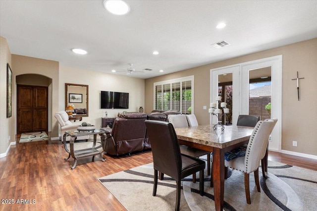 11025 E Nichols Ave, Mesa, AZ 85209 - dining space featuring light wood-style floors, recessed lighting, baseboards, and arched walkways
