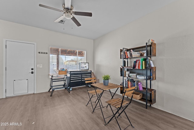 office area with ceiling fan and wood finished floors