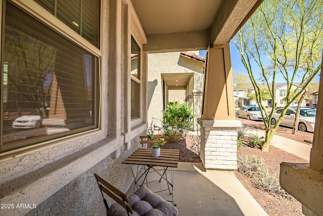 view of patio / terrace featuring a residential view and a porch