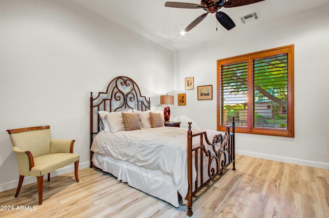 bedroom featuring light wood-type flooring and ceiling fan