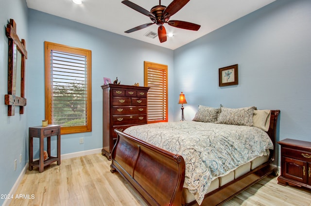 bedroom featuring light wood-type flooring and ceiling fan