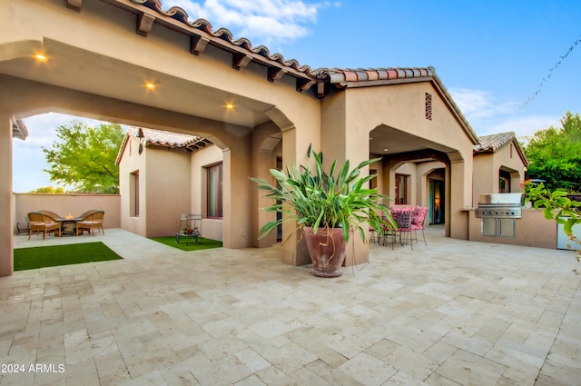 back of house featuring a patio