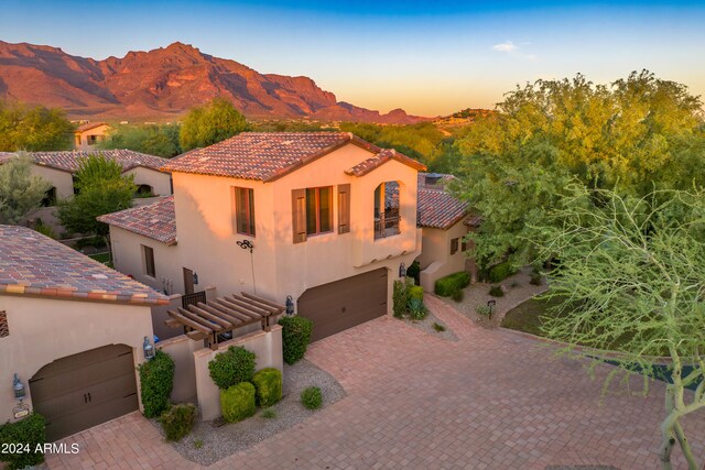 3129 S Honeysuckle Ct, Gold Canyon, AZ 85118 - view of front of property featuring a tiled roof, decorative driveway, a garage, stucco siding, and a mountain view