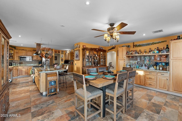 dining room featuring ceiling fan