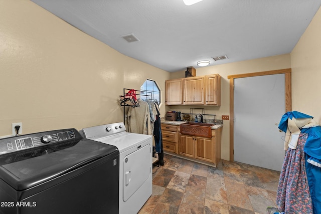 washroom featuring sink and washer and clothes dryer