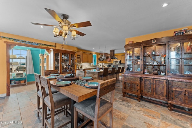 dining space with ceiling fan