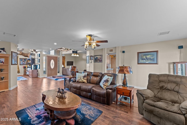 living room with ceiling fan and hardwood / wood-style floors