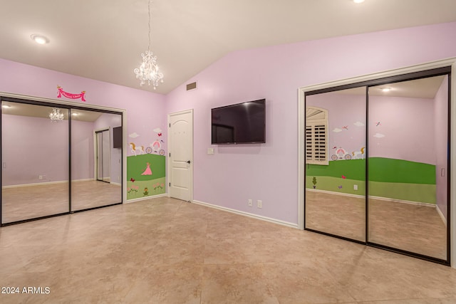 unfurnished bedroom featuring a chandelier and vaulted ceiling