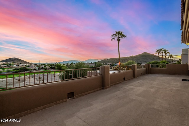 patio terrace at dusk with a mountain view