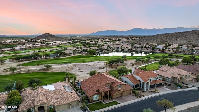 aerial view at dusk with a water and mountain view