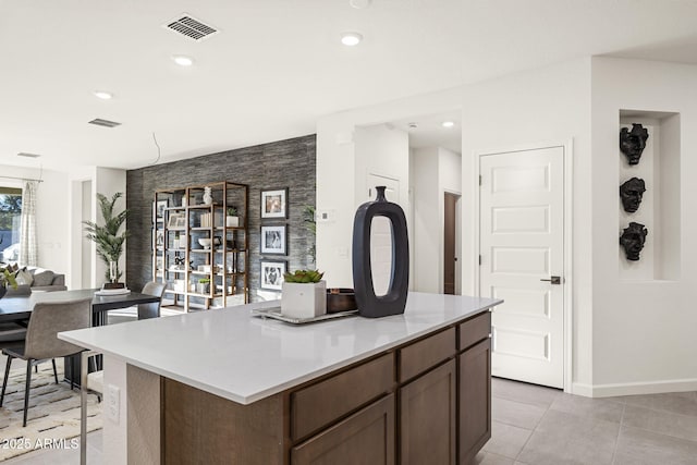 17738 W Onyx Ave, Waddell, AZ 85355 - kitchen featuring baseboards, a kitchen island, light countertops, light tile patterned floors, and recessed lighting