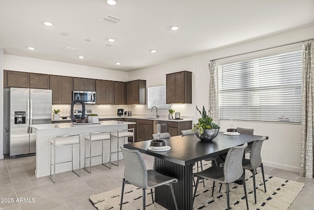 17738 W Onyx Ave, Waddell, AZ 85355 - dining space with recessed lighting and light tile patterned flooring