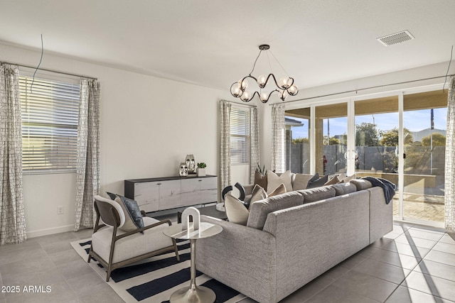 17738 W Onyx Ave, Waddell, AZ 85355 - tiled living area with a chandelier and baseboards