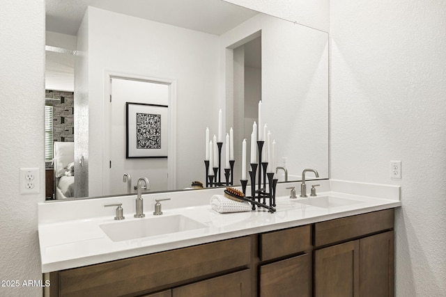 17738 W Onyx Ave, Waddell, AZ 85355 - full bath featuring ensuite bathroom, double vanity, and a textured wall