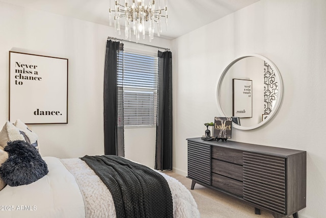 17738 W Onyx Ave, Waddell, AZ 85355 - bedroom with a chandelier, light colored carpet, and baseboards