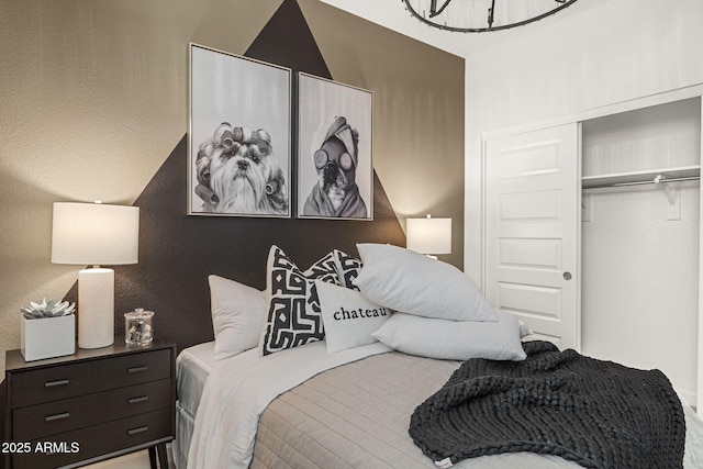 17738 W Onyx Ave, Waddell, AZ 85355 - bedroom with a closet and a chandelier