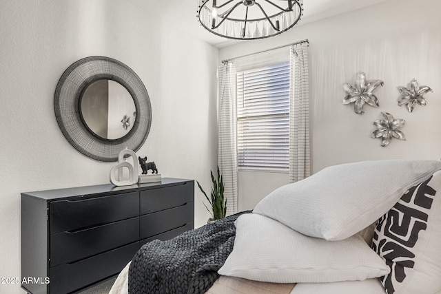 17738 W Onyx Ave, Waddell, AZ 85355 - bedroom with a chandelier