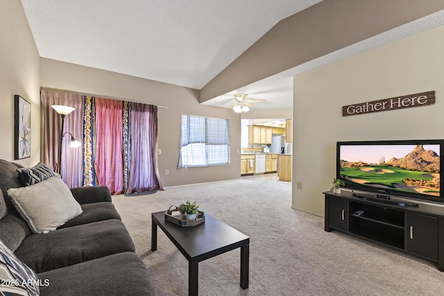 living area featuring a ceiling fan, light carpet, and lofted ceiling