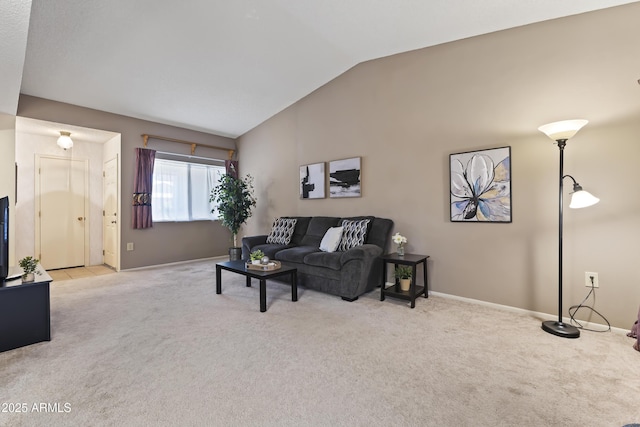 living room featuring lofted ceiling, baseboards, and carpet floors