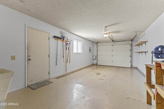 garage with a garage door opener and baseboards