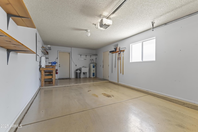 garage featuring baseboards, a garage door opener, water heater, and a sink