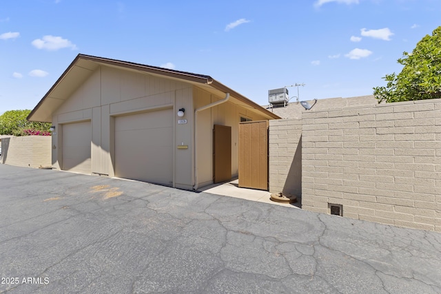 garage with fence