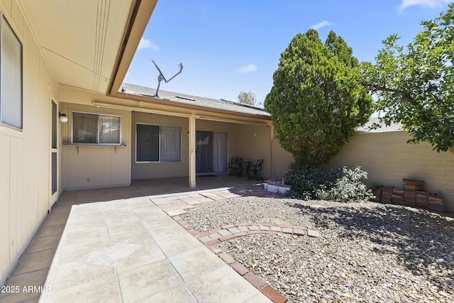 exterior space with fence and a patio