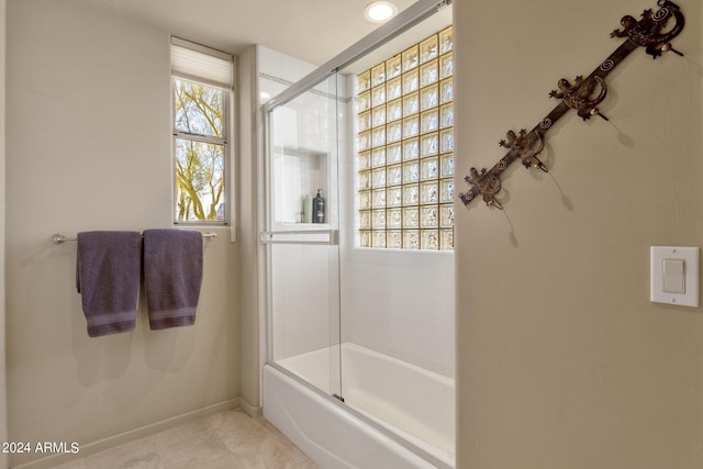 bathroom with tile patterned flooring and enclosed tub / shower combo