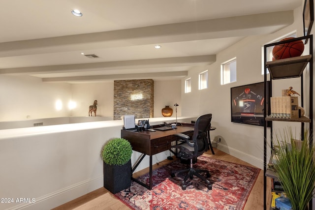 office featuring beam ceiling and light hardwood / wood-style flooring