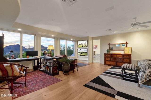 interior space with ceiling fan and light wood-type flooring