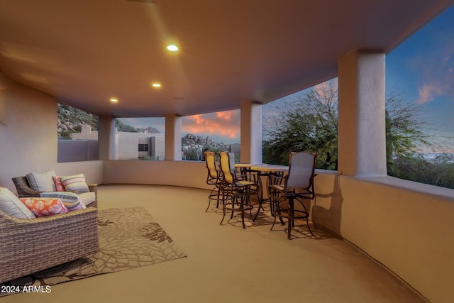 view of patio terrace at dusk