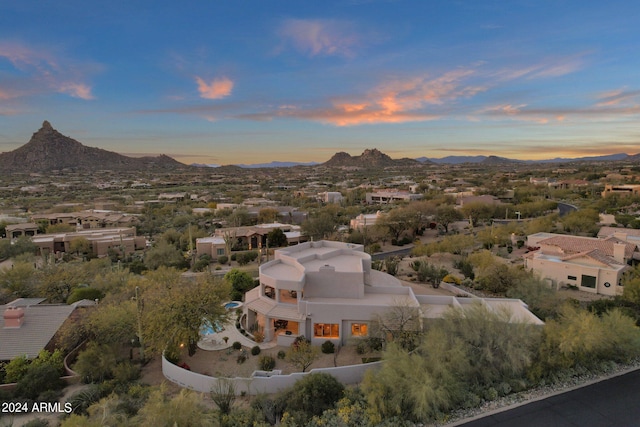 aerial view at dusk with a mountain view