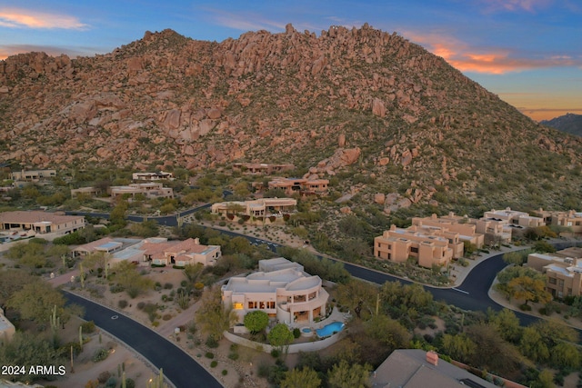 aerial view at dusk with a mountain view