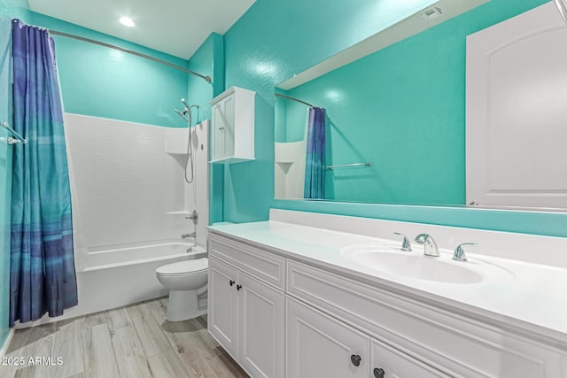 bathroom with vanity, toilet, and shower / bath combination with curtain