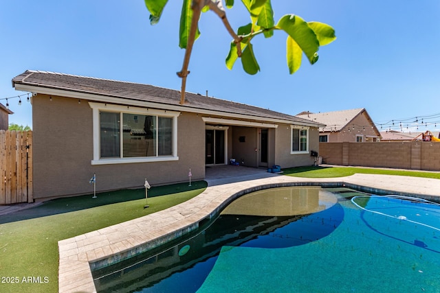 view of pool with a patio, a fenced in pool, and a fenced backyard