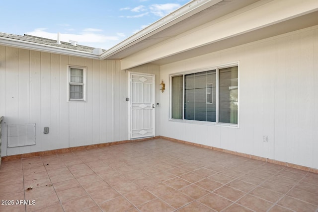 entrance to property featuring a patio area